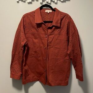 Burnt red/orange shacket with floral cutout designs size XL.